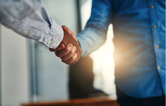 Two people shaking hands